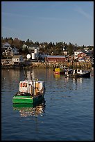 Traditional lobster boats and houses, late afternoon. Stonington, Maine, USA