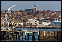 Pier and hillside buildings across harbor. Portland, Maine, USA ( color)