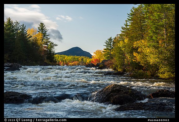 Haskell Rock Pitch cascades and Bald Mountain framed by trees in autumn foliage. Katahdin Woods and Waters National Monument, Maine, USA