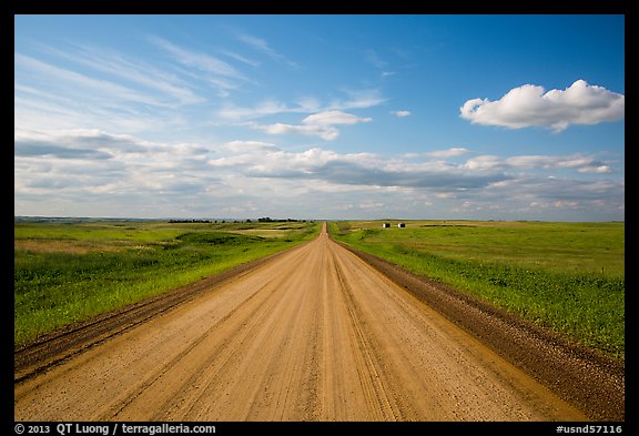 Gravel road in open prairie. North Dakota, USA