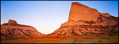 Cliffs glowing red at dawn,  Scotts Bluff National Monument. Nebraska, USA (Panoramic color)