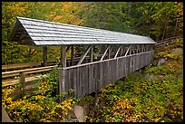 Wooden covered bridge in the fall, Franconia Notch State Park. New Hampshire, USA