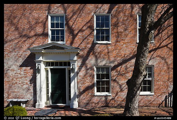 Brick house with tree shadows. Portsmouth, New Hampshire, USA