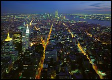 Streets at night from above with twin towers in background. NYC, New York, USA