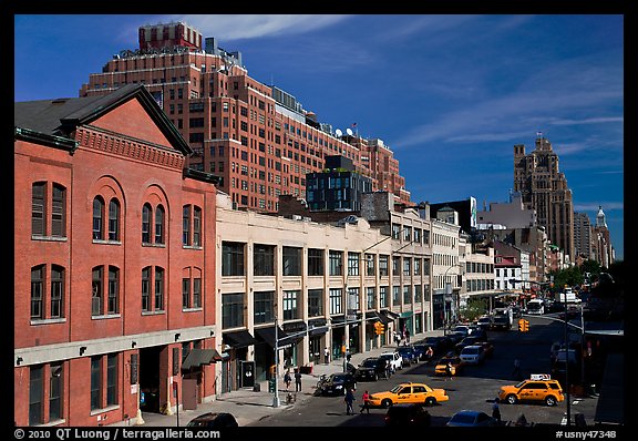 Taxi cars in streets and brick buildings. NYC, New York, USA