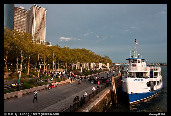 Tour boat along Battery Park, evening. NYC, New York, USA