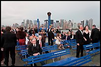 Black Tie gala guests on boat deck, New York harbor. NYC, New York, USA ( color)