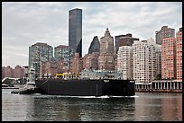 Barge on Hudson River and Manhattan waterfront. NYC, New York, USA (color)