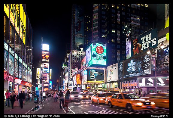 Picture/Photo: Yellow taxicabs, Times Squares at night. NYC, New York, USA