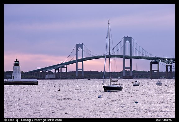 Newport Bridge and Newport Harbor lighthouse at sunset. Newport, Rhode Island, USA