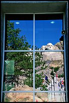 Cliff and sculptures reflected in a window, Mount Rushmore National Memorial. South Dakota, USA (color)