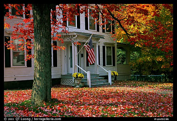 House with American flag and red leaves. Vermont, New England, USA (color)