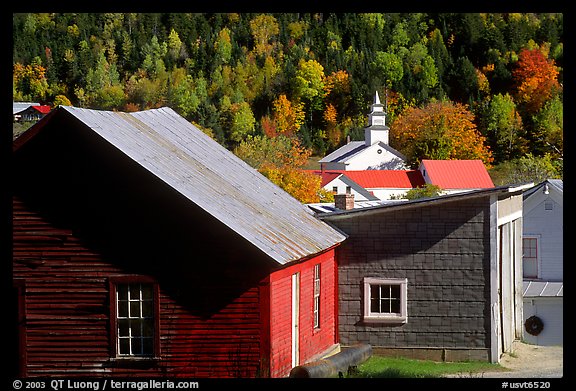 Red barn and East Topsham village in fall. Vermont, New England, USA
