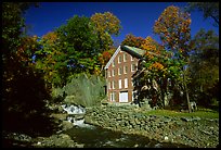 Old Mill next to a cascading brook near Stowe. Vermont, New England, USA (color)
