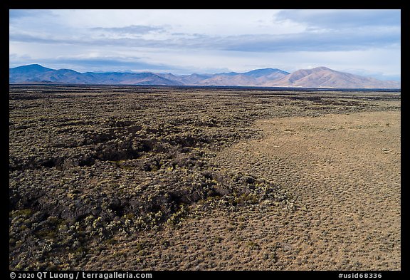 Aerial view of lava flow at edge of Little Park kipuka. Craters of the Moon National Monument and Preserve, Idaho, USA (color)