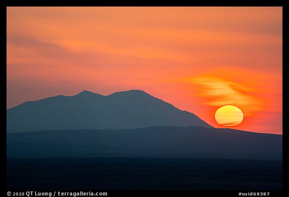 Sun rising and Big Southern Butte. Craters of the Moon National Monument and Preserve, Idaho, USA