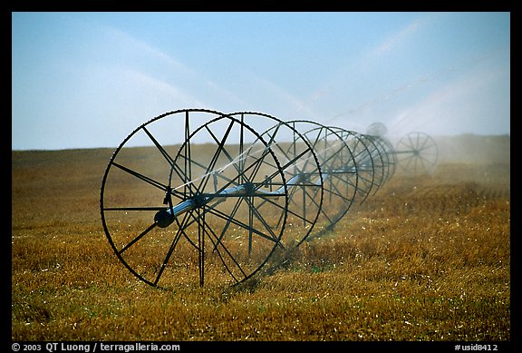 Irrigation wheels spraying water. Idaho, USA (color)