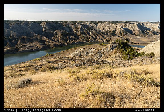 Grasses, badlands, and Missouri River. Upper Missouri River Breaks National Monument, Montana, USA