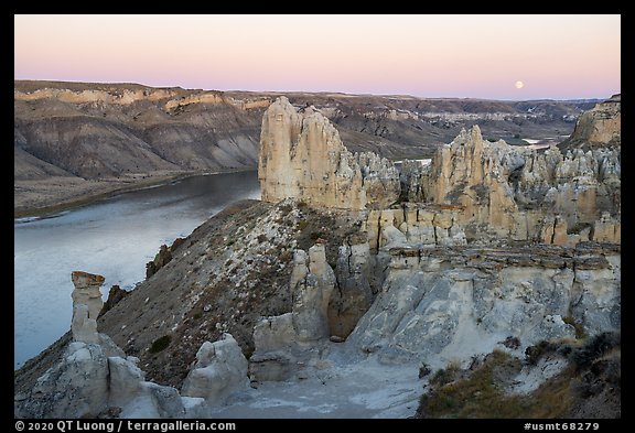 Sandstone pinnacles and moon. Upper Missouri River Breaks National Monument, Montana, USA