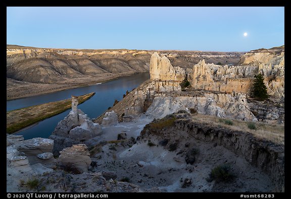 Rock columns and moon from Hole-in-the-Wall at dusk. Upper Missouri River Breaks National Monument, Montana, USA