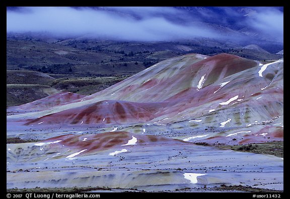 Painted hills and fog, winter dusk. John Day Fossils Bed National Monument, Oregon, USA (color)