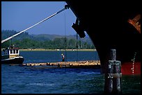 Timber, tugboat, and cargo boat bow. Oregon, USA (color)