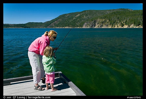 Mother and daughter on deck, East Lake. Newberry Volcanic National Monument, Oregon, USA (color)