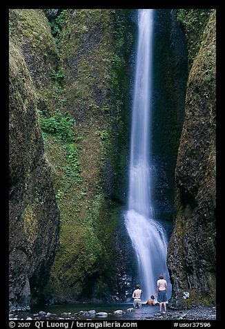 Men soaking at the base of Oneonta Falls. Columbia River Gorge, Oregon, USA (color)