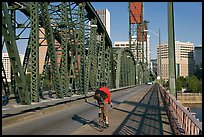 Bicyclist on Hawthorne Bridge. Portland, Oregon, USA