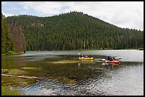 Family kayaking on Devils Lake. Oregon, USA (color)