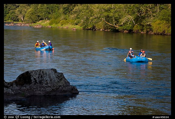 Two Rafts passing boulder, McKenzie river. Oregon, USA (color)