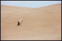 Motorcyle down dune, Oregon Dunes National Recreation Area. Oregon, USA (color)