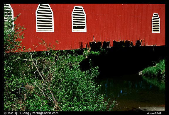 Detail of red covered bridge and river, Willamette Valley. Oregon, USA