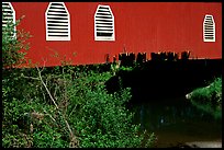 Detail of red covered bridge and river, Willamette Valley. Oregon, USA