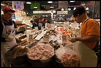 Countermen unloading seafood,  Pike Place Market. Seattle, Washington ( color)