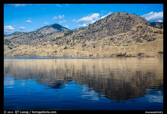 Dry hills reflected in Lake Chelan. Washington