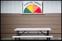Bench and vampire threat sign near Forks. Olympic Peninsula, Washington ( color)