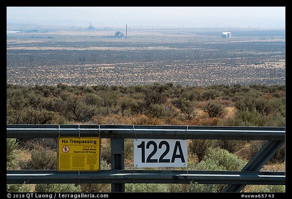 Fence and distant nuclear reactors, Hanford Reach. Washington (color)