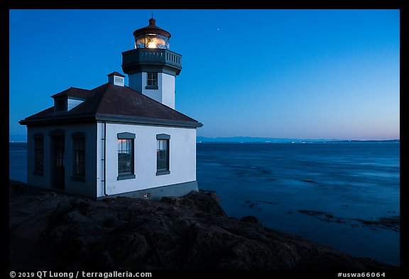 Lime Kiln Lighthouse and Haro Strait at dusk, Lime Point State Park, San Juan Island. Washington