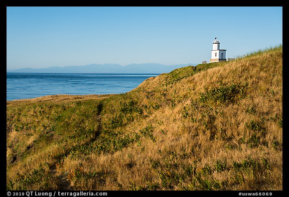Grassy hill with lighthouse, Cattle Point Natural Resources Conservation Area, San Juan Islands National Monument. Washington