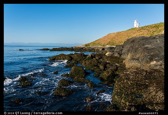 Rocky coastline and Cattle Point Lighthouse, San Juan Islands National Monument, San Juan Island. Washington