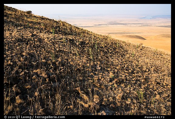 Hill with volcanic rocks and distant valley, Hanford Reach National Monument. Washington (color)
