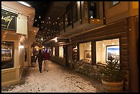 Alley with art galleries, winter night. Jackson, Wyoming, USA (color)