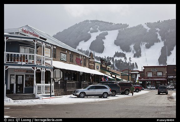 Town square stores and ski slopes in winter. Jackson, Wyoming, USA (color)