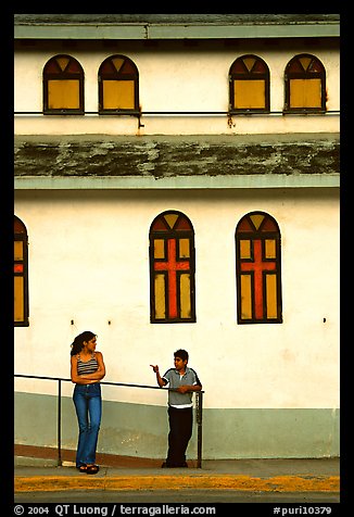 Woman and boy talking besides a church, La Parguera. Puerto Rico (color)