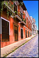Old cobblestone street and pastel-colored houses, old town. San Juan, Puerto Rico