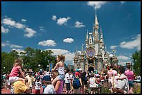 Girls on fathers shoulders, Cinderella Castle. Orlando, Florida, USA (color)