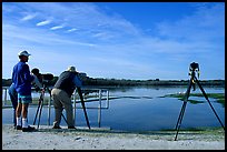 Photographers with big lenses, Ding Darling NWR, Sanibel Island. Florida, USA (color)