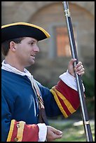 Man dressed as a Spanish soldier in the 18th century demonstrates gun, Fort Matanzas National Monument. St Augustine, Florida, USA