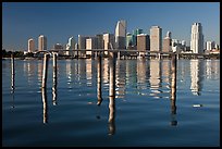 Bridge, pillings, and downtown skyline, Miami. Florida, USA (color)